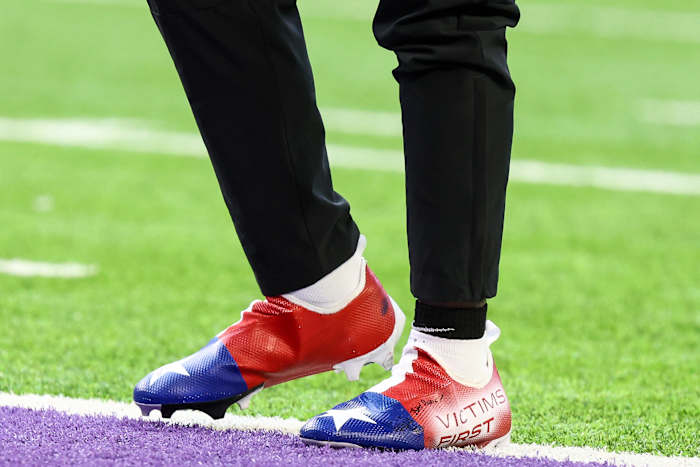 View of red, white, and blue cleats.
